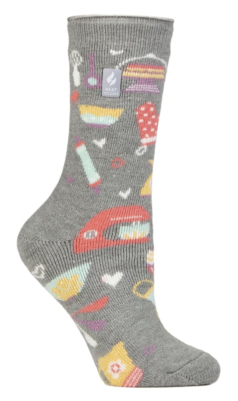 If you know a lady in your life who loves to keep themselves busy with hobbies and activities like baking, reading, gardening or even heading to the great outdoors then these Heat Holders Lite Hobby Socks are made for them!These Heat Holders Lite Hobby Socks are the perfect gift for any woman that loves doing hobbies and activities. They're also warm, comfortable and available in 5 great designs which are: Baking Queen, Positive Vibes, Book Lover, Wild At Heart & Gardening Guru!The Heat Holders Lite Tog rating are scientifically tested to be 5x Warmer than a basic cotton sock, with a tog rating of 1.6 and the Heat Holders Brushing process maximises the amount of warm air held inside each sock for total warmth and all day comfort.Our Specially developed Heat Holders thermal yarn provides high performance insulation against cold with superior moisture breathing abilities. The Heat Holders Loops provide Innovative knitting technology, extra long looped cushion pile to hold in more warm air, increasing the TOG rating.This version of Heat Holders solves the ‘too thick’ element to the original Heat Holders. These Thermal Winter Socks are thin enough to fit into your everyday shoes, but thick enough to still allow Heat Holders’ heat insulation techniques to work.These socks are available in Ladies One Size: 4-8 UK and come in 5 different designs. They are made from: 89% Acrylic, 10% Polyamide, 1% Elastane and are Machine Washable.