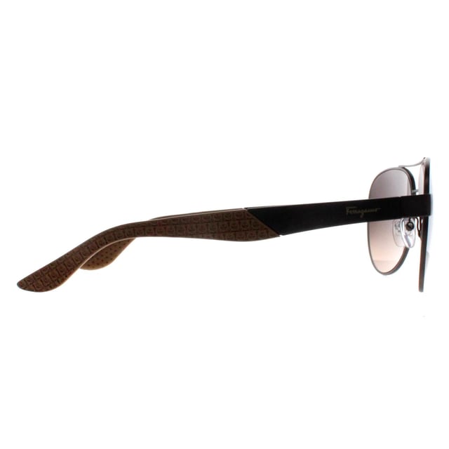 Salvatore Ferragamo Aviator Mens Matte Dark Ruthenium Grey Brown Gradient SF275S  Sunglasses exude luxury and elegance, embodying the refined craftsmanship for which the brand is known. These sunglasses feature a bold, aviator frame that makes a sophisticated statement, seamlessly blending modern design with timeless appeal. Made from high-quality metal , the SF275S offers durability and comfort, while the lenses provide full superb UV protection to shield your eyes from harmful rays. The subtle Ferragamo logo accents on the temples add a touch of understated opulence, making these sunglasses the perfect accessory for those seeking both fashion-forward style and premium functionality.