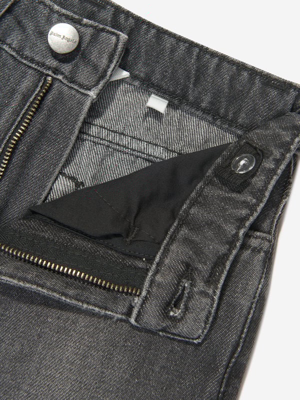 Palm Angels combine Italian craftsmanship with enigmatic Californian imagery. These boys black jeans are reflective of the label's passion for daring fits with an innovative twist. Depicted in a five-pocket denim design with a special 'Palm Angels' "Flames" print in orange, yellow and red on the left leg.  Regular Ft Wide Leg Fabric: 100% Cotton Lining: 65% Cotton, 35% Polyester