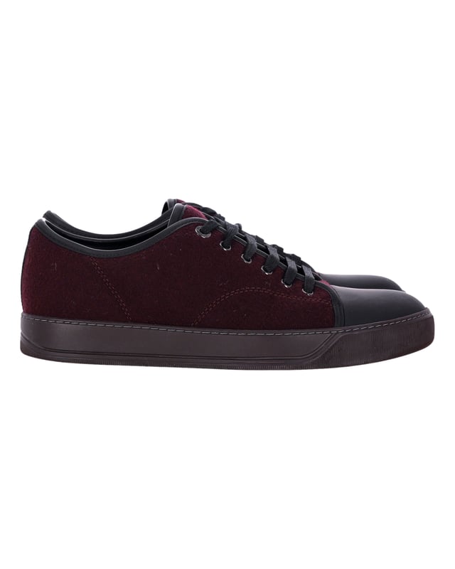 VINTAGE, RRP AS NEW
Elevate your sneaker game with the Lanvin DBB1 Matte Cap Toe Low Top Sneaker in Burgundy Suede. A true essential of the Lanvin men’s wardrobe, these sneakers are reimagined each season to offer a fresh take on a classic design. The low-top silhouette adds a casual touch, while the cap toe provides a refined, modern aesthetics. The burgundy suede material offers a sleek, sophisticated look that is perfect for any occasion. These sneakers embody the perfect blend of timeless style and contemporary flair, making them a must-have addition to any footwear collection. Make a statement with these Lanvin sneakers that seamlessly balance comfort and style.


With dust bag.

Lanvin DBB1 Matte Cap Toe Low Top Sneaker in Burgundy Suede
Color: Burgundy
Material: Suede
Condition: Very good
Size: EU40.5
Measurements: Heel height: 2; Insole length: 29
Signs of wear: Minor markings, Lightly used but very well maintained. Minor mark at soles & creasing, light scuffing at the soles and heels.
SKU: 367921