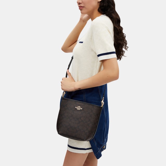 City Bucket Bag in Signature Canvas, Inside zip pocket,  Length: 16.50 cm,  Width: 11.50 cm,  Height: 21.00 cm