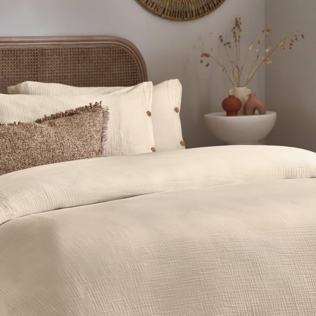 Inspired by timeless classic fabrics, the Lark duvet cover set is made from ultra-soft double-layer muslin cotton fabric. Available in a range of pastel tones, this bedding is complete with a wooden button closure. The cosy crinkle texture is perfect for bringing a relaxed, stylish feel to your bedroom. Cool and breathable in the summer months and snuggly and warm in the winter, muslin is used on both sides for an understated yet modern look. This product is certified by OEKO-TEX®, showing it has been sustainably made.
