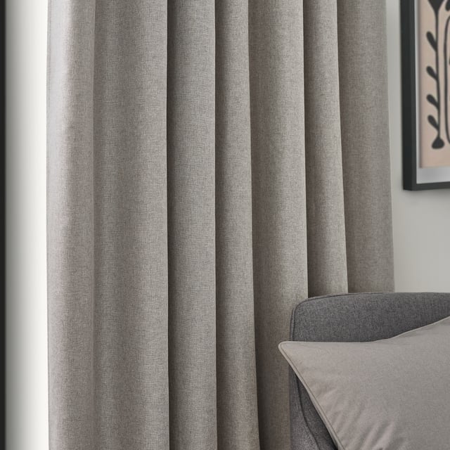 Transform your living space with Dawn Blackout Pencil Pleat Curtains, designed for those who value elegance and practicality. Crafted from soft-textured fabric with a modern marl effect, these curtains add refined style to any room while effectively blocking out light. Perfect for a restful night's sleep or creating the ideal movie-watching environment, their temperature-regulating properties ensure comfort year-round by keeping your home cool in summer and warm in winter. Enjoy the perfect blend of function and style with Dawn Blackout Curtains.