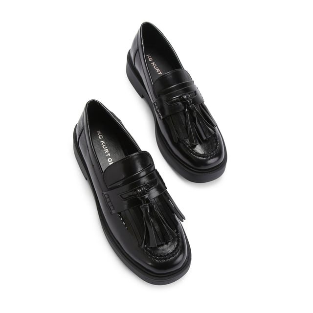 The KG Kurt Geiger Mack is a loafer featuring a black upper. There is a statement tassel detail on the toe.