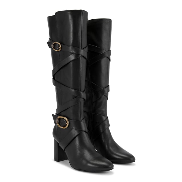 This Kurt Geiger Mayfair Strappy Knee high boot is crafted from a soft black leather with  strap detail up the entire shaft. There are two antiqued brass buckles with eagle heads across the straps. Heel height: 8cm.