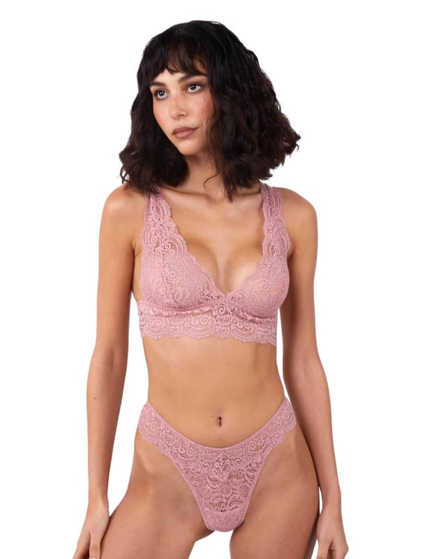 The Ariana range by Playful Promises brings this flirty thong that is perfect for adding a cute feeling to your daily life. Covered in semi-sheer lace it lays softly against your body. It has an extremely flattering shape with a high-cut leg that creates the illusion of longer legs whilst the mid-rise waist and minimal rear coverage showcase your incredible figure.  Flirty thong, Semi-sheer feminine lace, High-cut leg, Mid-rise waist and minimal rear coverage, Elasticated waistband, Comfortable fit, Country of origin: China, Composition: Main: 89% Polyamide | 11% Elastane, Composition: Gusset Liner: 100% Cotton, Listed in UK sizes.   Thong