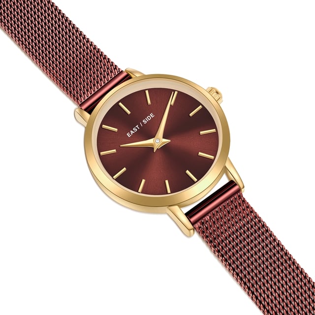 GENERAL INFORMATION:  • Targetgroup: Female  • Wristwatch: No Special Functions  • Display: analogue  • Weight of watch w/o box (gr.) - approx.: 24,0  MOVEMENT:  • Movement: Quartz  • Term of Movement: VC10  • Origin of movement: Japan  BRACELET:  • Material of bracelet/strap: Stainless steel  • Plating of bracelet/strap: Ion-Plating (IP)  • Finishing of bracelet/strap: Smooth  • Finishing/Decoration of bracelet/strap: None  • Clasp/Closure/Buckle: Slide Clasp  • Color of bracelet/strap: bordeaux  • Length of bracelet/strap (mm) approx.: 190,0  • Width of bracelet/strap (mm) approx.: 9,5  • Style/Design of bracelet/strap: Mesh band (Millanaise Style)  • Bracelet/strap adjustable?: No  CASE:  • Shape of case: Round  • Size/Diameter of case in mm . approx.: 24,0  • Height of case in mm: 7,6  • Case material: Metal (Alloy)  • Surface of case: Polished  • Bezel/Topring: Fixed  • Finishing/Decoration of case: None  • Material of case back: Stainless steel  • Lock of case back: No screwed-in crown  • Color of case: Yellowgold  • Coating/Plating (Case): Ion-Plating (IP)  • Type/Form of crystal: Flat  • Material of crystal: Mineral crystal  • Water resistant (ATM): 3  DIAL:  • Size jewelry care cloth: Hour, Minute  • Indices: Line indices  • Material of dial: Brass  • Structure/pattern of dial: Flat  • Color of dial: bordeaux  PUSHER, CROWN, HAND:  • Pusher: None  • Corrector: No  • Crown: No screwed-in crown  • Type of hands: Dauphine hands  • Luminescent (hands): No  PACKAGING & SCOPE OF DELIVERY:  • Box: Yes  • Service booklet: Yes  • Manual: Yes