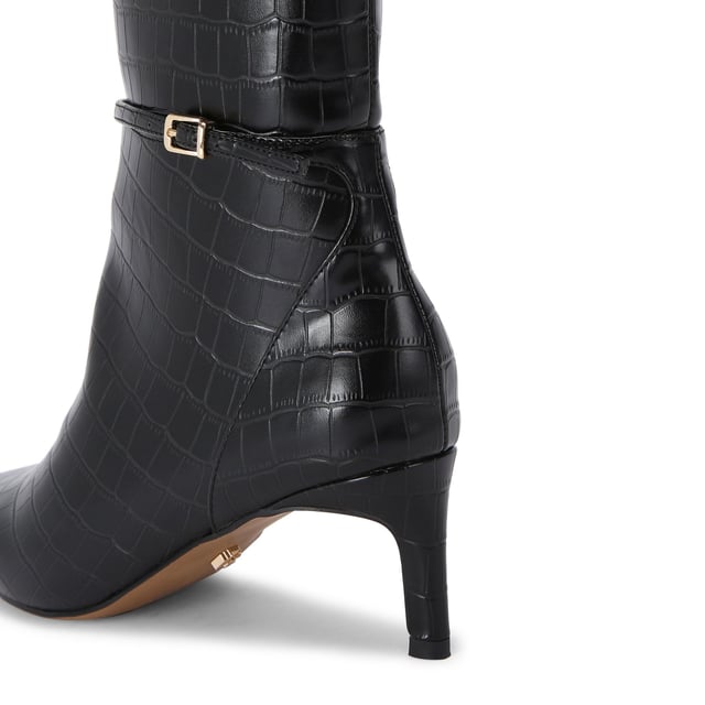 This Carvela Impress High Boot features an across embossed upper in black. There is a thin ankle strap with gold buckle. This product features All Day Long technology.