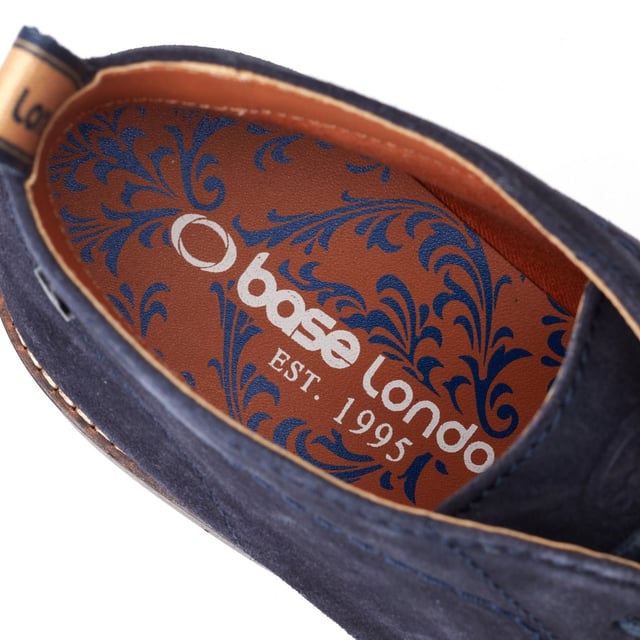 Stride in style with the Knebworth Men's Chukka Boot by Base London. Boasting premium leather uppers, a laid-back 3-lace closure, and a robust nylon pull tab for easy on/off, this Chukka boot features an Orthorlite insole for added comfort.