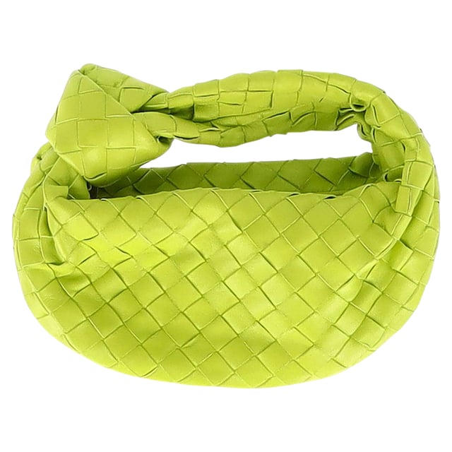 VINTAGE, RRP AS NEW
Chic and Luxurious: Elevate your style with the Bottega Veneta Mini Jodie Handbag in Green Intrecciato Leather, a chic and luxurious accessory that exudes understated glamour. The intricately woven leather in a stunning green color adds texture and dimension to the structured silhouette, while the compact size makes it the perfect statement piece for any outfit. This handbag is a symbol of impeccable craftsmanship and exquisite design.

Bottega Veneta Mini Jodie Handbag in Green Intrecciato Leather
Condition: Very good
Signs of wear: No retail tag, Minor sign of wear or markings., Lightly used but very well maintained. Minor creasing, light worn corners, light scratches.
Packaging: Dust bag
Color: Green
Material: Leather 
Size: One size
Measurements: Width: 30; Height: 130; Length: 240
SKU: NAPPUGBBA371345W