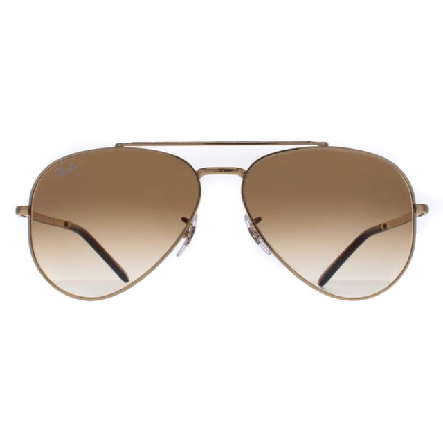 Ray-Ban Aviator Unisex Polished Gold Light Brown Gradient RB3625 New Aviator  Sunglasses are a fusion of classic design and modern innovation. With a nod to the iconic aviator silhouette, these sunglasses feature a sleek metal frame and bold double bridge, delivering a contemporary twist on a beloved style. The updated, slightly squared lenses offer a fresh take on the traditional aviator shape, exuding confidence and sophistication. Crafted with precision and attention to detail, these sunglasses not only make a fashion statement but also provide exceptional UV protection, ensuring both style and eye safety.