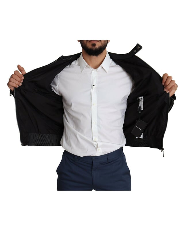 Stunning Dolce & Gabbana Black Bomber Jacket
  Leather details on shoulders and sleeves
  Color: Black
  Full zipper closure
  Logo details
  Made in Italy
  Material: 60% Nylon 40% Leather
  Lining: 90% Nylon 10% Leather
Material: 60% Nylon 40% Leather