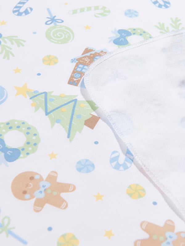 Introducing the Baby Boys Sweet Gingerbread Swaddle Blanket by Magnolia Baby, in pristine White color ‚ an addition of high-fashion to Baby Boys' nursery collections! Here are its sterling features:  Gingerbread Design ‚ A sprinkle of fun added with whimsy gingerbread prints, instantly getting your baby into a comfortable &amp; playful mood.  Luxuriously Soft ‚ Tailored from premium fabric that promises a velvety feel against baby's sensitive skin, securing them in cozy comfort.  Next-Level Nursery ‚ This chic swaddle blanket uplifts your Baby Boy's nursery essentials, becoming a highlight in no time. Gift your little one with this high-quality blanket, letting him drape in style!