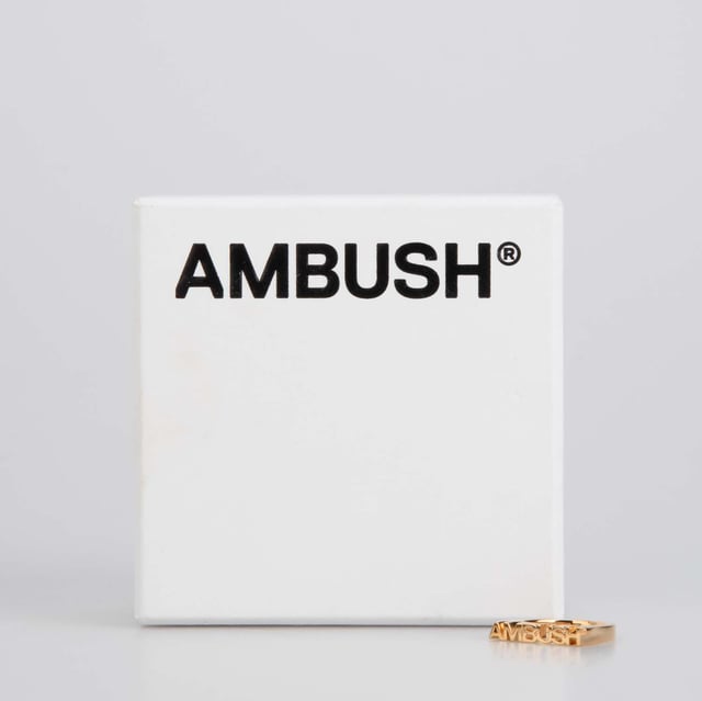 Ambush Nameplate Ring in Gold.- Large logo lettering.- 100% Brass. Ref: BWOC0220017600.