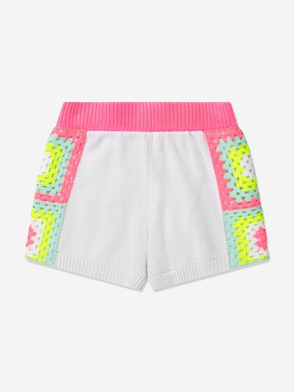 Introducing the exquisite Girls Knitted Shorts in White from premium designer Billieblush. This chic garment is an essential addition to your girl's attire. It flaunts classic elegance and top-notch comfort, making a perfect fit for any occasion. Key features include:  Sophisticated Design: This piece boasts a clean, white hue, embedded with intricate knitted patterns. It's the blend of simplicity and elegance.  Luxuriously Soft: Created with high-quality, soft material, ensuring ultimate comfort for your child throughout the day.  Elevate her wardrobe! Include these Girls Knitted Shorts in White by Billieblush. Shop now and let your girl bask in the elegance of high-end fashion!
