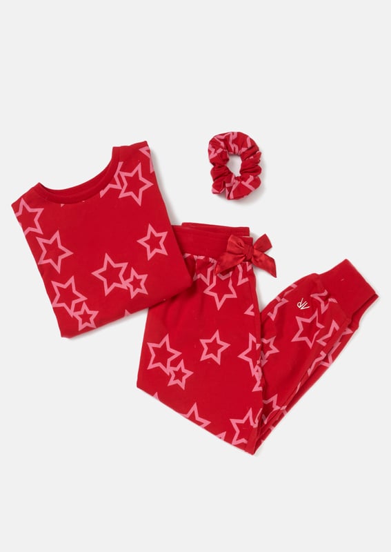 Perfect for your little dreamer. These hot pink star PJs in festive   are made in the softest jersey and come with a matching hair scrunchie. Ideal for gifting. Reach for the stars!. About Me: 95% Cotton 5% Elastane. Look After Me: Think Planet. Wash At 30C.