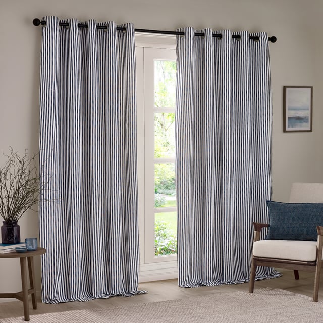 Transform your living space with Hebden Striped Eyelet Curtains. Crafted from 100% cotton, these woven striped curtains offer a super soft yet durable finish, ensuring long-lasting beauty and ease. Perfectly balancing style and substance, the versatile design exudes a classic minimalist charm, while the room-darkening lining adds practicality. Whether you're seeking serenity or a restful night’s sleep, these curtains deliver quality, making them an essential addition for those who cherish natural materials and refined aesthetics.