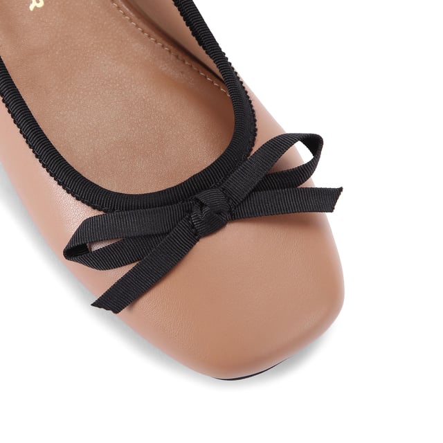 The KG Kurt Geiger Marvyn is a camel ballet flat with black bow on the toe and flat block style heel.