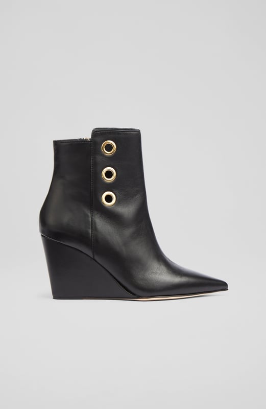 LK Bennett Brie Ankle Boots,Black A stand-out pair of ankle boots in our new collection, the Brie boots offer wear-all-day comfort and contemporary chic in equal measure. Beautifully made in Italy from buttery soft black nappa leather, they have a pointed toe, gold eyelet detail, an inside zip and a leather wedge 80mm heel. Sleek and sexy, slip them on with dresses and skirts as well as smarter, more tailored looks.