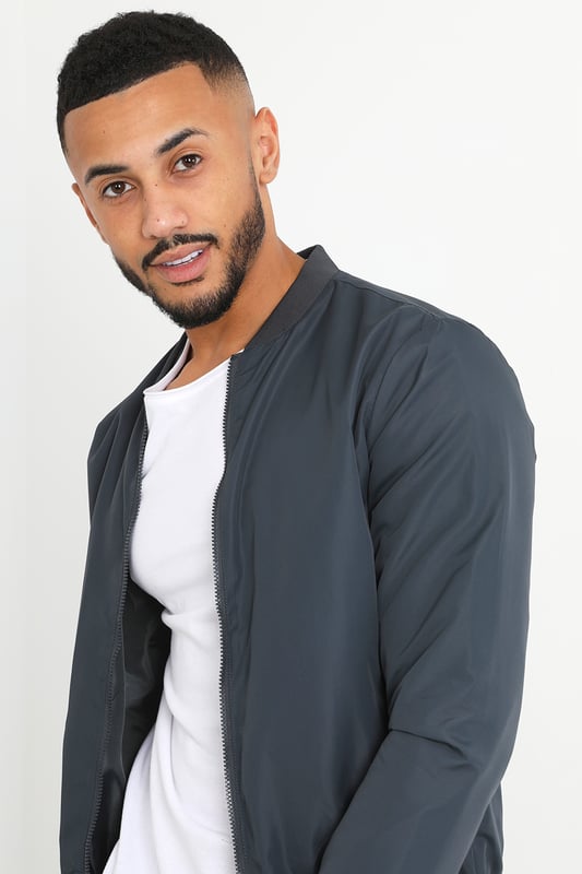 This bomber jacket from Brave Soul is a stylish and comfortable addition to your wardrobe. The ribbed hem, collar, and cuffs provide a classic touch, while the two lower zip pockets add a practical element to the jacket. With a regular fit, this jacket offers a relaxed yet trendy look and is fully lined. Whether you're heading out for a night out or running errands, this bomber jacket is sure to keep you comfortable and stylish.