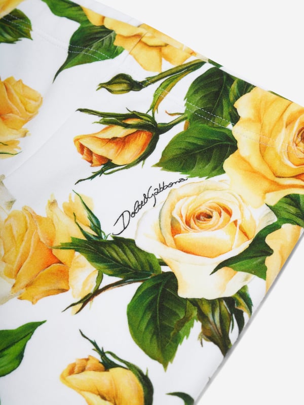 Dolce  Gabbana incorporate innovative materials with vintage abstracts into coexisting spaces. These girls rose leggings capture the Italian label's mesmeric craftsmanship and purity of design. As part of the girl‚ flowering collection, each piece is depicted in a veritable riot of yellow roses. Presented as interlock leggings with all-over yellow rose print. She will look and feel divine.  Made in Italy Multi-Coloured Regular Fit Stretch Waistband Placed Print Inner Leg: 47cm on Size 6 Years Hem: 10cm on Size 6 Years Print Placement Will Vary Due to  Aspect  External Composition: 90% Cotton, 10% Spandex