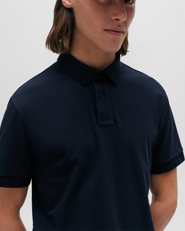 A slim-fitting polo shirt with short sleeves by BOSS Menswear, crafted in soft piqué with a tonal logo patch. By purchasing this product, you are contributing to protecting the environment and sustainable cotton farming in Africa. CmiA is committed to improving the living and working conditions of African cotton farmers and to preserving nature.
Slim fitFlat-knit collarNumber of buttons: 3Short sleevesFlat-knit cuffs
95% Cotton, 5% Elastane
50507803