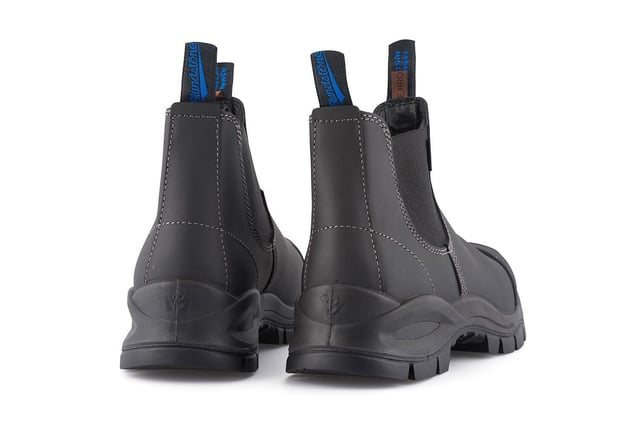 The ultimate workplace boot, these Blundstone 910 safety boots provide all-day support, comfort and protection. Made from premium, durable platinum black leather uppers with a CES3 safety rating, a low shaft with an elasticated side for easy slip-on and a hardened steel toe cap, these Blundstone 910 boots are the ultimate everyday boot. These 910 boots are the result of decades of experience in crafting the highest-quality Australian footwear and whether it be at home, work or anywhere else life takes, these Blundstone boots are a perfect choice.Designed with Blundstones patented shock protection system (SPS) and manufactured with a Thermo urethane outsole and polyurethane midsoles, these 910 boots are built to withstand anything you can throw at it. They also come with a hardened broad fitting steel toe capable cap of resisting a 200 Joule impact with additional kick guard toe protection to ensure your safety is never compromised. However, safety does not come at the expense of comfort with these Blundstone boots; they are made with a steel shank for added support on uneven terrain in addition to a toe spring to help reduce fatigue over long periods of use. Details  Broad fitting steel-toe cap resistant to impacts over 200 Joules Genuine black leather uppers that are oil, acid and organic fat resistant Ergonomically engineered toe spring to help prevent wearer fatigue Full heel breast with arch support to ensure safety on ladders and gantries Highly durable PU midsole and TPU outsole are strongly resistant to hydrolysis and microbial attack Made with Blundstone's patented SPS and XRD™ Technology for increased shock protection Removable Xtreme comfort EVA footbed provides all-day underfoot comfort The V Cut upper reduces stitching exposure and ensures long-lasting durability of these Blundstone boots Outsole resistant to temperatures of up to 140F/60C Low shaft elasticated side for easy slip-on Kickguard toe leather protection Firm supporting steel shank helps with torsional stability on uneven terrains