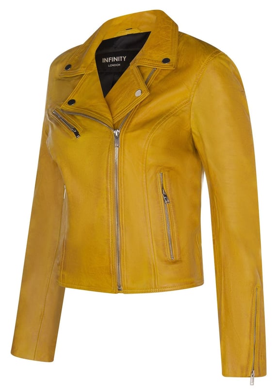 Elevate your style with our timeless best-selling jacket, celebrated for its minimalistic design that never goes out of fashion. Here's why it's a must-have:  
Iconic Minimalism: This jacket's enduring popularity stems from its understated elegance. Its front features just three subtle pockets, each adorned with hand-polished metal hardware zips, creating an effortlessly stylish and minimalistic look. 
Classic Brando Style: Emulating the iconic Marlon Brando jacket from the 1950s, it boasts a double-breasted design with a wide notched lapel and an off-centered YKK zip, paying homage to the timeless fashion icon. 
Color Variety: Choose from a range of colorways to suit your preferences, whether you opt for bold shades like yellow, red, and green, or classic hues like black, tan, and chestnut. 
Premium Material: Crafted from 100% premium ultra-soft nappa leather, this jacket offers both luxury and comfort. 
Tailored Fit: Designed with a slim fit and a shorter length, it complements your body's shape and provides a modern and flattering silhouette.  Furnished with three zipped exterior pockets and zipped cuffs, this jacket combines practicality with enduring style, making it a versatile addition to your wardrobe.