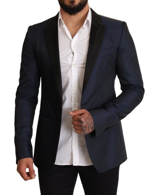 Stunning Dolce & Gabbana MARTINI Slim Fit Blazer Jacket
  Single breasted one-button style
  Slim fit for a great fitting and comfort
  Beautiful blue color
  Three outside pockets and two inside pockets
  One open vent in the back for breathability
  Logo details for a signature touch
  Made in Italy with premium materials
  Material: 6% AC 50% PL 11% Silk 33% Wool
  Lining: 100% Silk
Material: 6% AC 50% PL 11% Silk 33% Wool