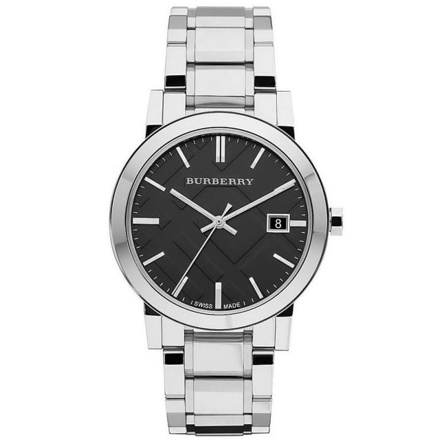 Burberry BU9001 Unisex Check Stamped Watch in stainless steel. The watch is powered by a quartz movement and fastens with a stainless steel bracelet. Other features include date function, black dial and baton hour markers. The watch comes with a Burberry presentation box. 38mm width