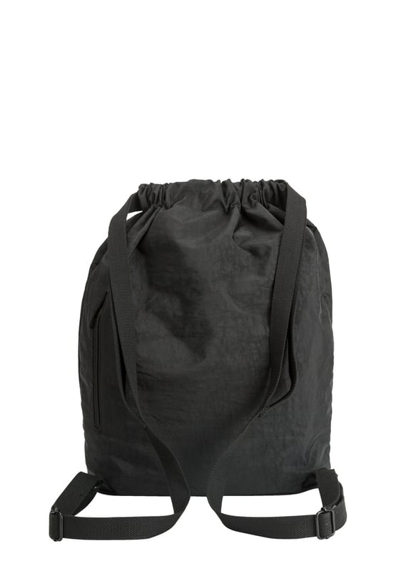 A medium-sized drawstring backpack made in crushed nylon fabric. This practical everyday backpack has plenty of space and multiple pockets for you to organise your essentials. Its lightweight and stylish design will complement any outfit. Ideal for heading to school, daily commuting or a weekend away. Features: , Artsac rubberised patch logo, Drawstring opening, Adjustable shoulder straps, Exterior front and back zipped pocket, Internal zip and slip pockets, Splash proof crushed nylon Style Ref: 50295 BLACK