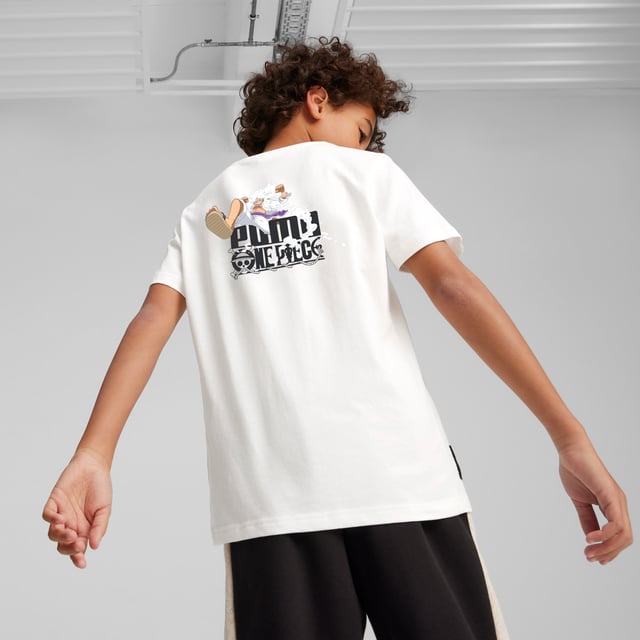 PRODUCT STORY: PUMA x ONE PIECE combines the worlds of manga and sports, with streetwear-relevant styling. We've taken inspiration from the Four Emperors to create this graphic tee. The perfect top for anyone who's a child of the sea. Ready to go treasure-hunting? FEATURES & BENEFITS: Made with at least 20% recycled cotton. DETAILS: Branded "Shanks" graphic on chest; PUMA x One Piece co-branded woven label on the sleeve; Stealthy PUMA label on the side; Crew neck; PUMA Youth: Recommended for older kids between 8 and 16 years.  Our model is 152 cm tall and is wearing size 152 RUS.