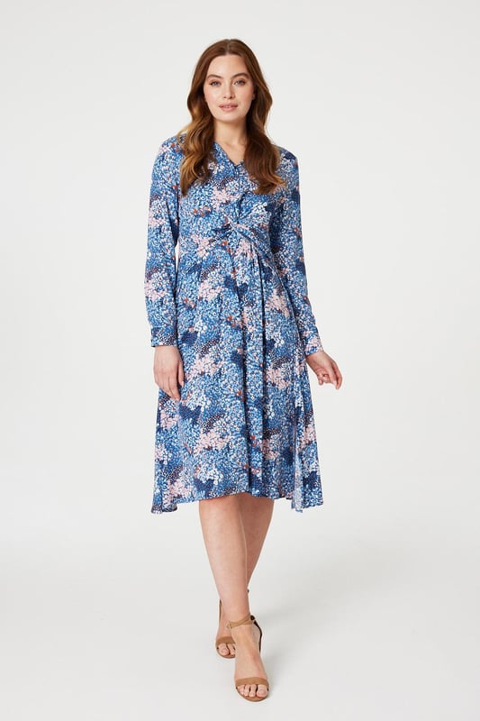 Refresh your daytime occasion wear collection with this printed midi dress. It has a classic collar with a v-neck, button front detail, a twist front embellishment, long sleeves with cuffs, a shirred back detail and a midi length skirt with a side split. Finish your look with elegant blush heels and an a neutral clutch bag.