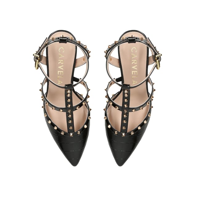 The Carvela Samba Court heel features a black upper with statement gold studs across the straps. The enclosed toe is pointed and the heel is in a stiletto style. Heel height: 70mm.