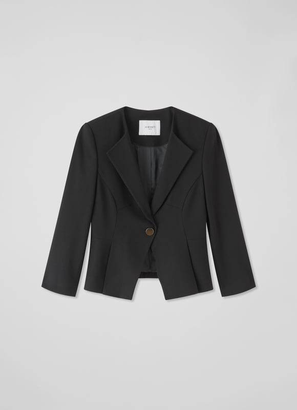 Beautifully tailored, totally timeless and kind to our planet, the new Sky jacket works as part of a wear-forever suit with the Sky skirt. Crafted in Europe from a black LENZING™ ECOVERO™ viscose* blend crepe, it's a shapely, single-button style with an open collar, a cut-away front and bracelet sleeves with button detail. Wear it with the matching pencil skirt when occasions call or for days in the office. This suit is a keeper. 

*More about the fabric
LENZING™ ECOVERO™ viscose uses up to 50% less emissions and 50% less water than standard viscose. This fibre relies on wood pulp, and is crafted from sustaibly maged tree species such as beech, spruce and eucalyptus.