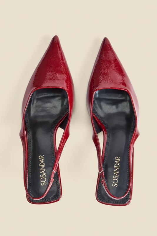 Accessories on point Crafted from luxe crinkle leather in a stunning cherry red patent finishChic slingback with an elasticated insert for a comfortable fit Sexy pointed toe silhouetteSet on a super-wearable flared kitten heel We love them with jeans and a blazer