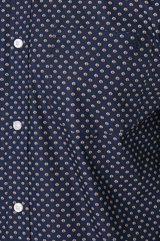 Striking geometric print for a modern twist on classic shirting
        Button-down collar for a smart-casual look
        Long sleeves with adjustable cuffs for versatile styling
        Chest pocket adds a functional touch
        Regular fit allows for comfortable movement
    
    This Maine geo print long sleeve shirt is a versatile addition to any wardrobe, perfect for those seeking a balance between style and comfort. The eye-catching geometric pattern adds interest to your ensemble without overwhelming it, making it suitable for various casual occasions. Pair it with your favourite jeans and trainers for a relaxed weekend look, or dress it up with chinos and loafers for a smart-casual dinner out. The cotton fabric ensures breathability and ease of care, ideal for the busy modern man. Layer it under a jumper on cooler days or wear it open over a plain t-shirt when the weather warms up. Whether you're heading to a family gathering, meeting friends at the pub, or enjoying a casual day at the office, this shirt will keep you looking effortlessly stylish.