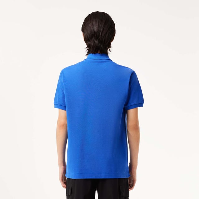 inchLacoste  inventor of the polo since 1933 Original L.12.12 Polo. Made by Lacoste. The Icon. Collar  button placket  petit piqué fabric - these are the components thought by René Lacoste. Yes  René did it first. 90 years ago  he challenged the status quo by creating the first polo to bring more freedom of movement on and off court. And put a crocodile at heart  making Lacoste the first brand who put a logo on clothing. Classic fit  comfortable ease on body and sleeves Original L.12.12 polo in our iconic petit pique renewed every season in a new large color palette. The Petit Piqué fabric is a Lacoste signature. It made of fibers knit together at two different levels of tension. The result? A finely honeycombed fabric that enables air to circulate freely. This fabric ensures comfort  ease of movement and elegance. Ribbed collar and cuffs Side slits Invisible hem Real mother of pearl buttons 3cm green crocodile at chest inch.