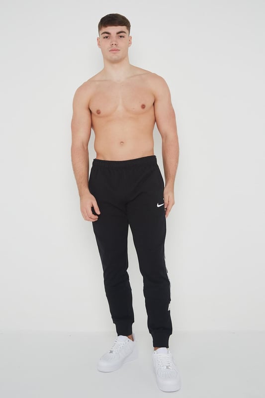 Nike repeat pack logo taping cuffed hotsell joggers in black