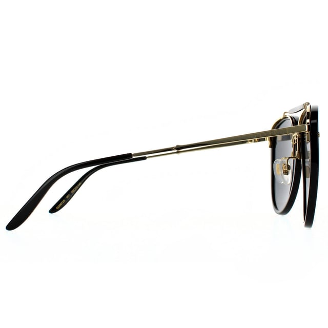 Gucci Aviator Mens Shiny Black and Gold Grey Sunglasses Gucci are a feminine aviator style crafted from lightweight acetate with contrasting metal details. Teardrop shaped polyamide lenses are framed in plastic, with a distinctive top bar, metal bridge and adjustable nose pads. Super slim metal temples are finished with a Gucci logo engraving..