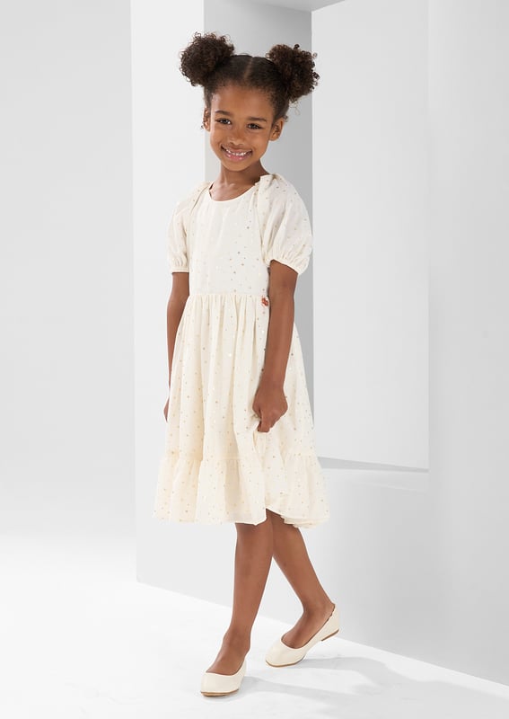 When you wish upon a star.. You get this stunning puff sleeve knee length dress with pretty open back detail scattered with gold foil stars. Heavenly... About Me: 100% Polyester. Look After Me: Think Planet. Wash At 30C.