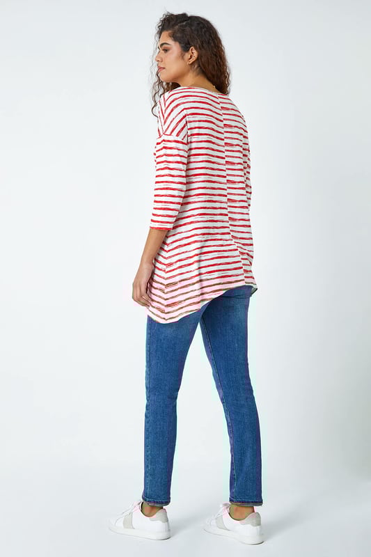 Abstract Stripe Print Stretch Top from Roman. Stripe it lucky this Spring with our newest casual top. Keeping the warmer weather in mind, this striped top is cut from a lightweight stretch jersey for a comfortable style that’s designed for all day wear. It has a modest round neckline, 3/4 length sleeves and a playful hanky hemline that makes it great for transitioning into the new season. A broken stripe print adds a new twist to the timeless nautical trend. Wear with jeans and trainers for the perfect Summer day style.