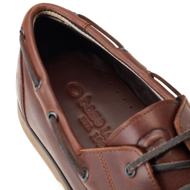 Base London Stern Leather Men's Burnt Brown Boat Shoes Its time to unlock your inner Boaty McBoat Face with the Stern boat shoe from Base London. Stern has been crafted from premium leather uppers and features detailed side lacing a contemporary rubber sole and an Ortholite footbed.