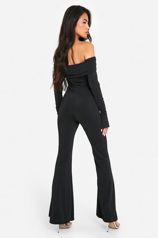 On the hunt for the perfect new-season piece? This bardot jumpsuit is just for you. Sitting off the shoulder for a flattering fit, an off the shoulder jumpsuit is the perfect addition to your summer collection. Curve accentuating, shoulder enhancing, and super easy on the eye, this style seriously brings the heat. From classic black bardot jumpsuits with ruffle detailing to white bardot jumpsuits perfect for long summer days, we've got you covered. Just add strappy sandals and you're ready to go. Style: UnitardFabric: SlinkyLength: RegularNeckline: BardotSleeve Length: Long Sleeve