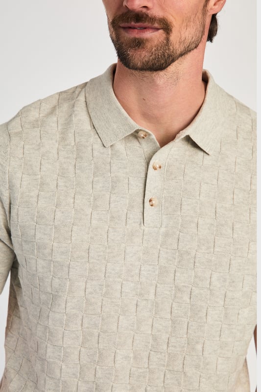 Beige Cotton Short Sleeve Button-Up Polo Shirt This textured polo shirt from Nines Collection blends classic sophistication with modern design. Crafted from a premium cable fabric with a subtle pattern, it offers a refined yet contemporary look. Lightweight and breathable, it’s a versatile choice for smart-casual occasions, ensuring style and comfort effortlessly. Made from 100% Cotton.