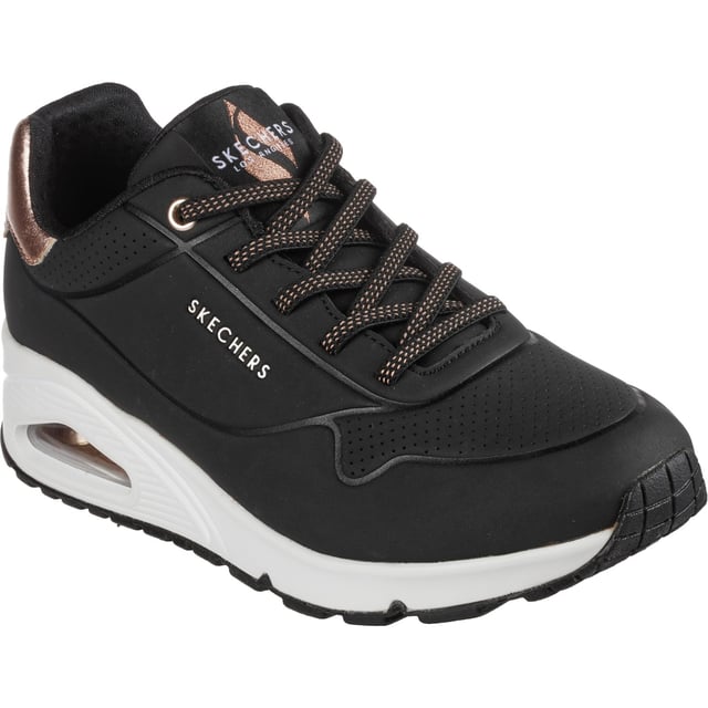Slip-on a classic style in comfort wearing Skechers Street Uno - Shimmer Away. This fashion sneaker features a synthetic durabuck upper with a metallic trim, stretch laces, Skechers Air-Cooled Memory Foam insole and Skech-Air visible airbag midsole.