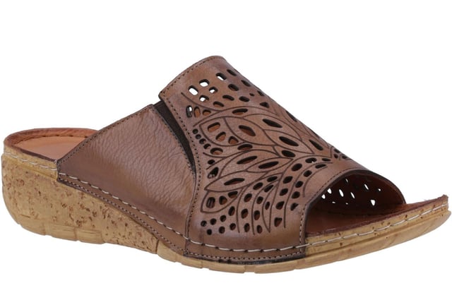 The Riva Cardigan Sandals offer a perfect blend of elegance and casual comfort. These open-toe wedge mules feature a refined leather upper with decorative cut-outs, adding a touch of sophistication to their design. The easy slip-on style ensures effortless wear, while the strap design provides a secure fit.
 Enjoy superior comfort with a lightly padded leather footbed and a lightweight bark-effect platform wedge heel that combines natural charm with modern style. Contrast stitching accents enhance these chic sandals, and the grippy outsole ensures stability with every step.
 - Leather upper 
 - Decorative cut out 
 - Easy slip on, open toe design 
 - Strap design 
 - Lightly padded leather foot bed
 - Contrast stitching accents
 - Bark/wood effect heel
 - Grippy outsole