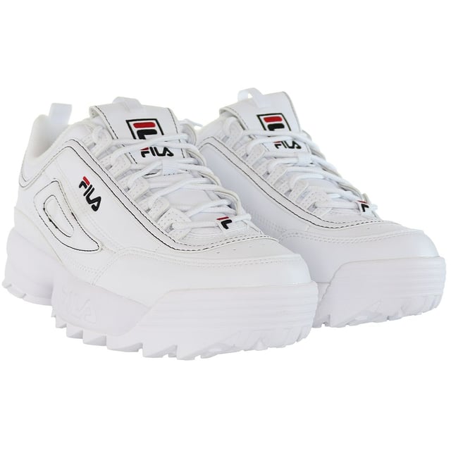 The Fila Disruptor Kids White Trainers are a classic and stylish choice for children's athletic and casual footwear. Here's a description of the key features:

 White Design:  These trainers come in a clean and timeless all-white color, making them a versatile and fashionable option that can be easily paired with a wide range of children's outfits.

 Chunky Sole:  One of the standout features of the Fila Disruptor series is the chunky and exaggerated sole design, which provides a distinctive and bold look.

 Leather Upper:  These trainers are typically constructed with a durable leather upper that offers both style and longevity, ideal for active kids.

 Padded Collar and Tongue:  The trainers usually come with a padded collar and tongue for added comfort and support around the ankles, which is important for kids.

 Lace-Up Closure:  They feature a traditional lace-up closure, allowing for a secure and customizable fit.

 Fila Branding:  You can expect to find the Fila logo and branding prominently displayed on these trainers, showcasing their authenticity and quality.

 Traction Outsole:  The trainers often have a durable and grippy rubber outsole, ensuring stability and grip on various surfaces, which is crucial for active children.

In summary, the Fila Disruptor Kids White Trainers are a fashionable and reliable choice for children who want a distinctive and stylish look in their athletic and casual footwear. The chunky sole design and classic all-white color make these trainers stand out, and the combination of leather and padded elements provides comfort and durability. Fila's iconic branding and quality are showcased in this model, making it an excellent option for parents looking for both style and functionality in their children's footwear.