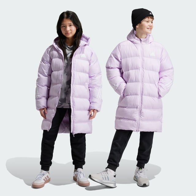 Made from sturdy ripstop and padded for warmth, this juniors' adidas jacket is your go-to during the colder months. Designed to keep the elements at bay without weighing you down, this long jacket offers plenty of coverage as you venture outdoors. A hood shields you from rain, while pockets keep your belongings tucked away. This product is made with 100% recycled materials. By reusing materials that have already been created, adidas help to reduce waste and our reliance on finite resources and reduce the footprint of the products adidas make.  - This model is 152 cm and wears a size 11-12Y. Their chest measures 70 cm and the waist 60 cm. - Regular fit - Full zip with hood - 100% polyester (recycled) - Front pockets - Self-fabric cuffs  Shipped by adidas