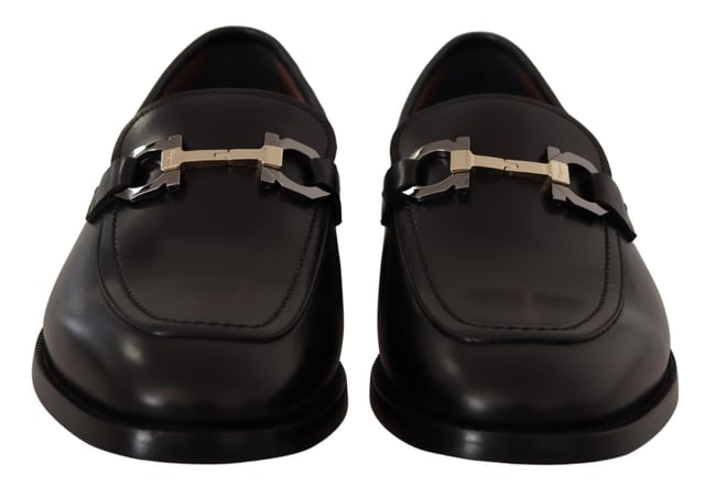 Brand new with tags and dust bag
  100% authentic Salvatore Ferragamo mens shoes
  Model: Lewis
  Color: Black
  Material: 100% Calf Leather
  Formal version of the gentlemens loafer
  Calf leather tumbled and hand buffed for depth of color
  Gancio bit in cool palladium finish
  Open grooves reveal stitching on leather sole
  Made according to Originali construction method
  Made in Italy
Material: Calf Leather